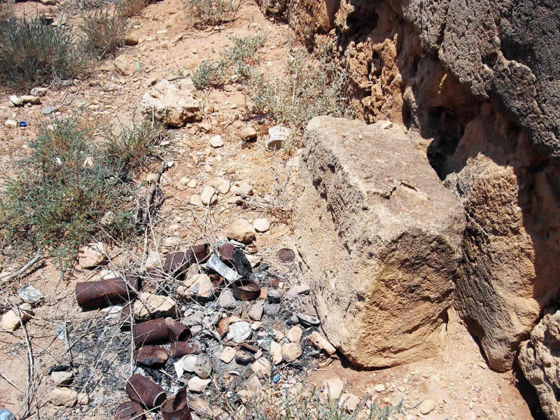 rusty tins piling up in an archaeological site