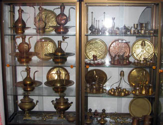 copper and brass ornaments on display