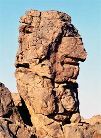 acacus, a rock carved by wind into the shape of an old man