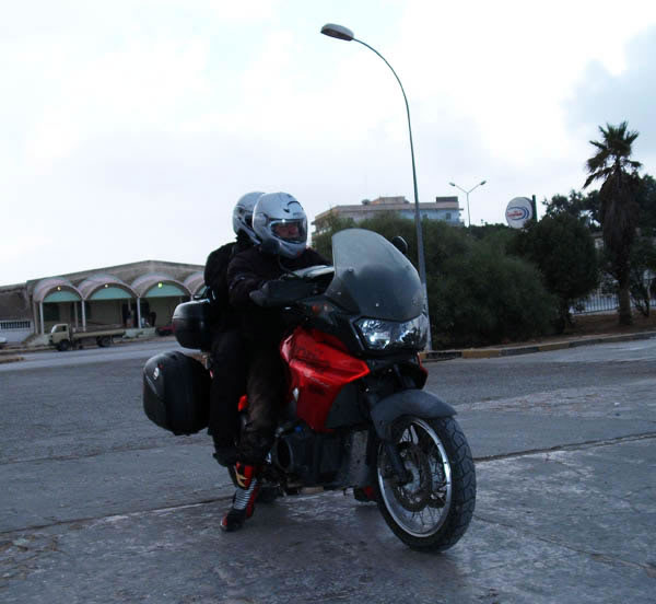 a couple on a  motorbike in one of the recent crossing tours