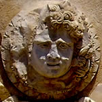 Medusa or gorgon's head looking left