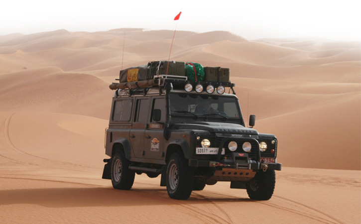 land rover through the Sahara's sand dunes