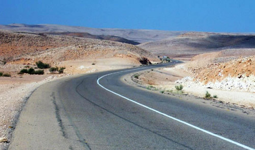 mountain road with white line but no yellow line