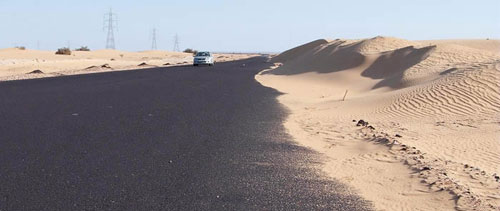 sand encroaching on tarmac road