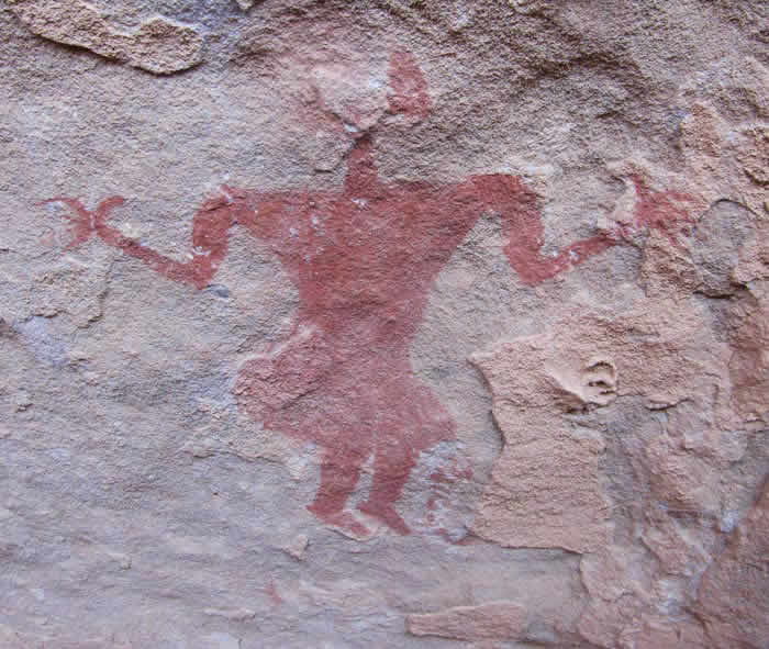 a painting of a round head woman, in red