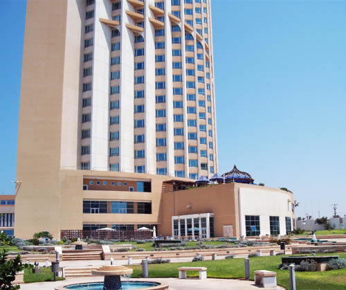 corinthia hotel, front view showing the garden and the fountain