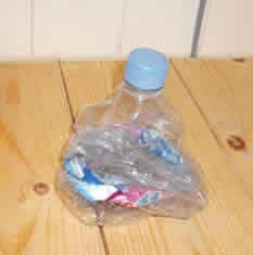 squashed bottle with the lid replaced, to stop air going in again.