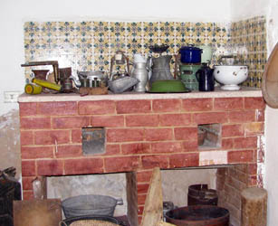 kitchen utinsils on display on brick top