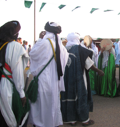 new Tuareg ghadames festival  adults dancing with women playing the tamborine