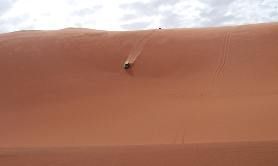 driving down a sand dune in the sahara