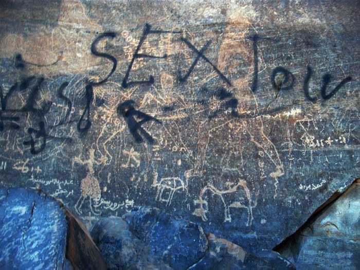 a prehistoric art painting from Acacus vandalised with graffiti