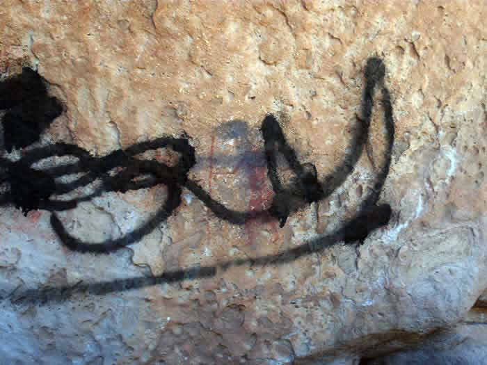 a prehistoric art painting from Acacus vandalised with graffiti