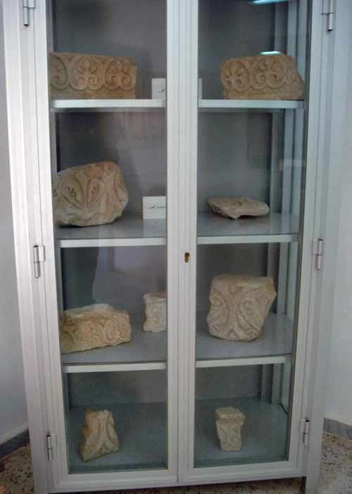 stones with designs inside a display cabinet.