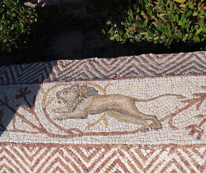 a mosaic scene showing a lion