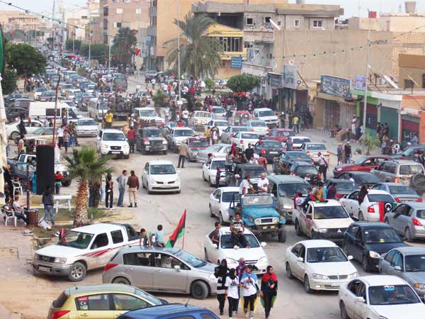 zuwarah a street full of people celebrating