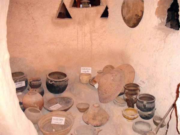 small clay pots, straw covers