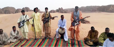 kader tarhanin group playing in open desert
