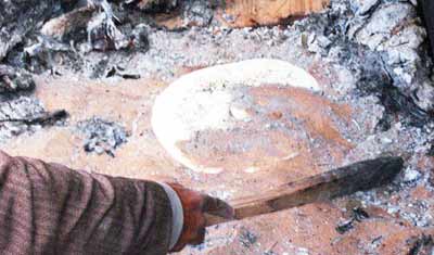 cooking bread in hot sand, Ghadames, Libya