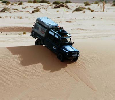 driving over a sand dune, acacus