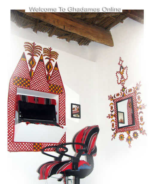 Ghadames: red paint designs on white walls