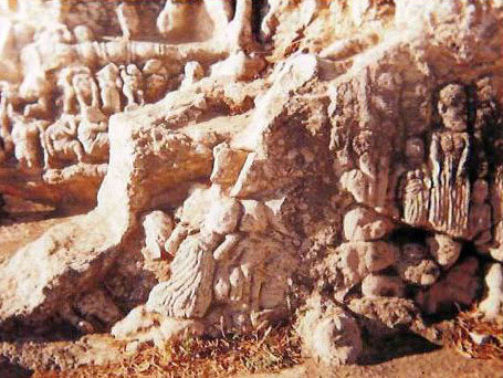 slonta statues carved directly on the cave's walls