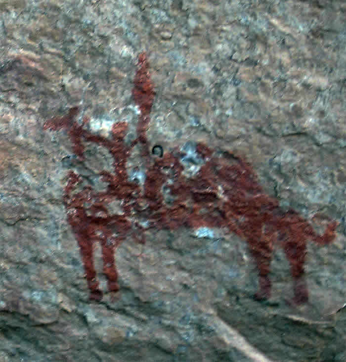 an abstract camel paintings with people on top