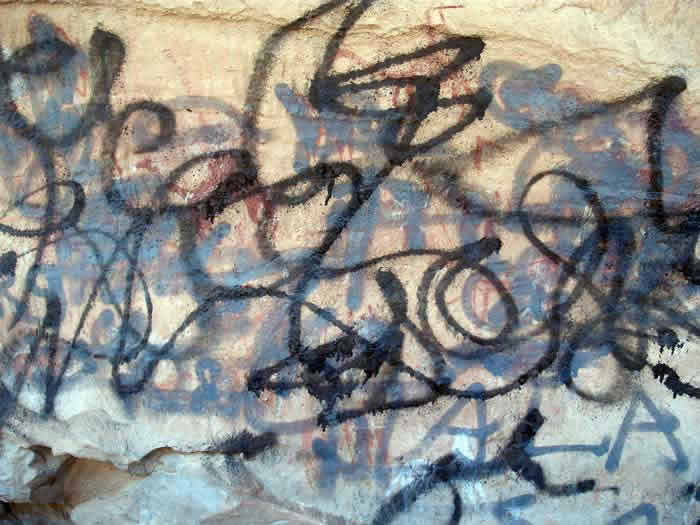 a prehistoric art painting from Acacus vandalised with graffiti