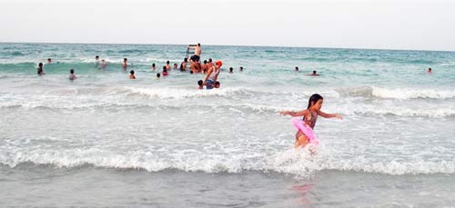 children playing by the beach